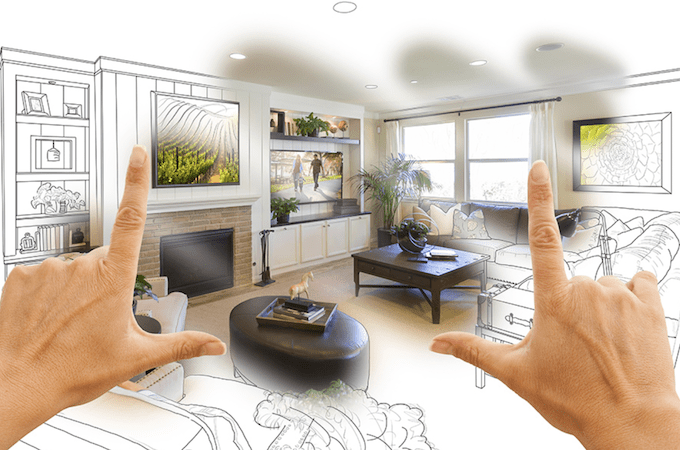 A screenshot from the Home Depot website with two hands held up showing a living room being designed and tested via AR.